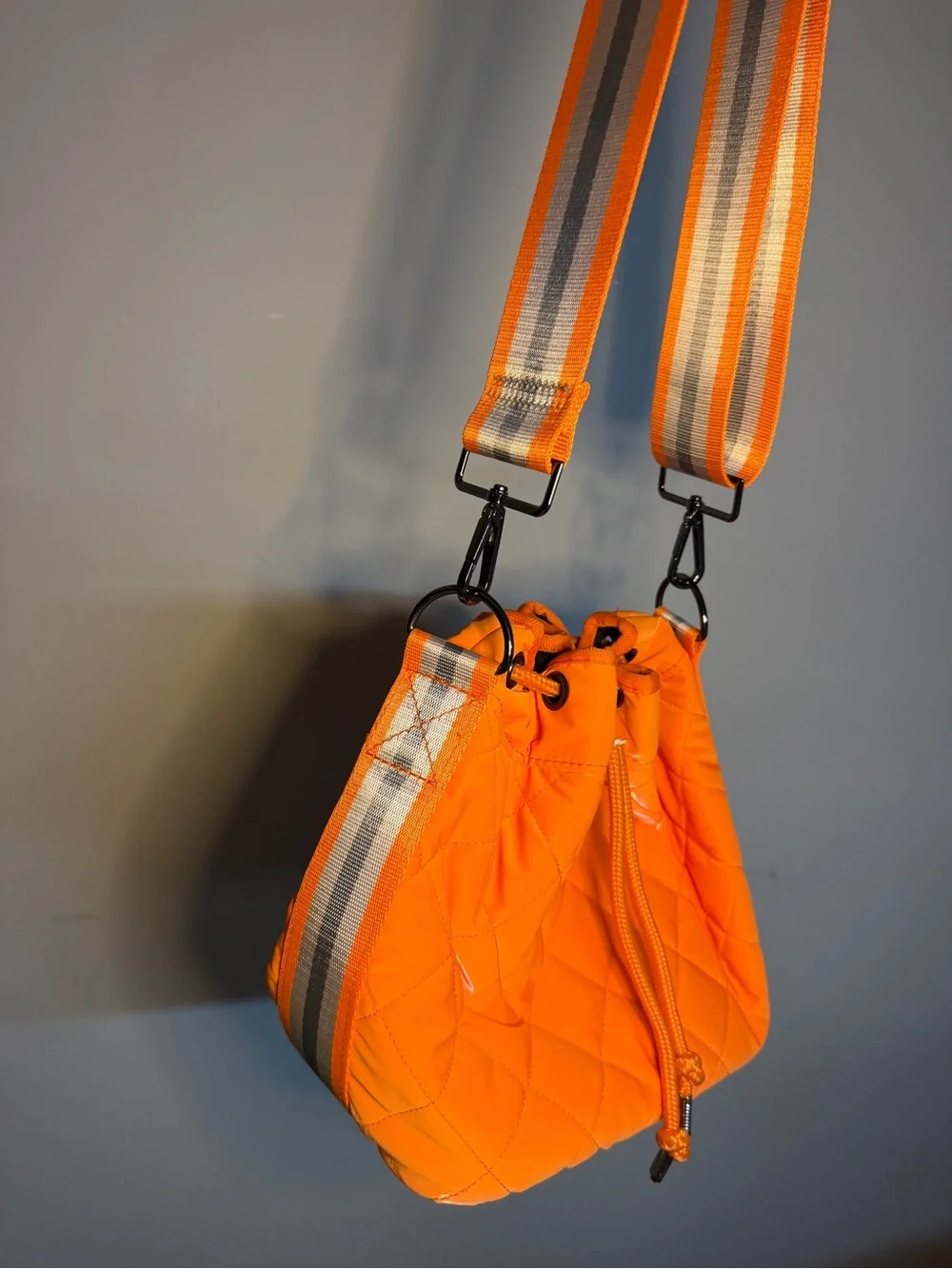 HAUTE SHORE Orange Quilted Crossbody with Striped Strap